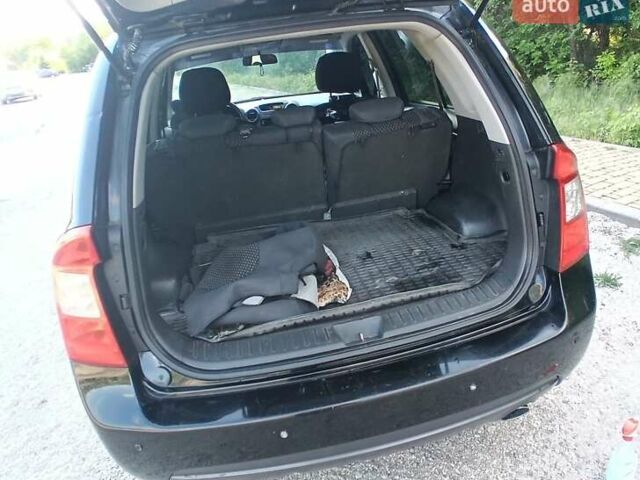 Чорний Кіа Каренс, об'ємом двигуна 2 л та пробігом 265 тис. км за 5800 $, фото 4 на Automoto.ua