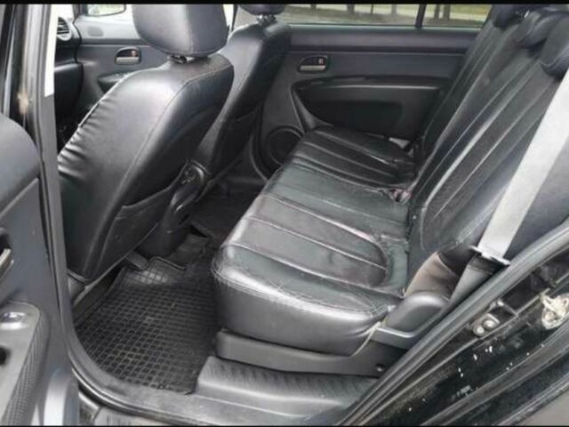 Черный Киа Каренс, объемом двигателя 2 л и пробегом 299 тыс. км за 3000 $, фото 4 на Automoto.ua