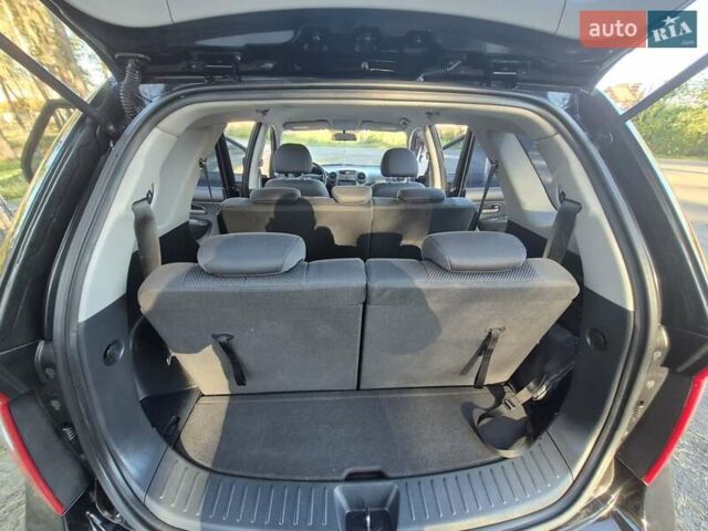 Чорний Кіа Каренс, об'ємом двигуна 2 л та пробігом 88 тис. км за 6450 $, фото 57 на Automoto.ua