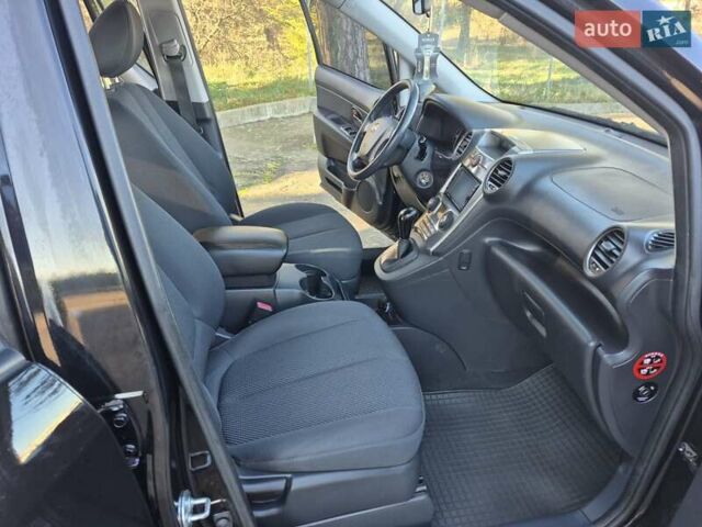 Чорний Кіа Каренс, об'ємом двигуна 2 л та пробігом 88 тис. км за 6450 $, фото 40 на Automoto.ua