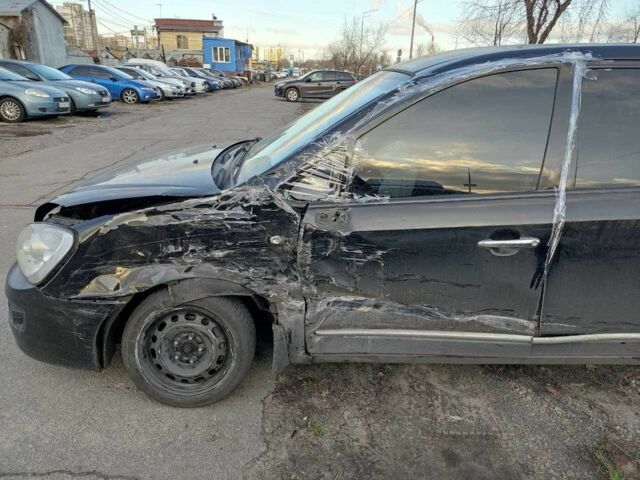 Черный Киа Каренс, объемом двигателя 1.98 л и пробегом 340 тыс. км за 3000 $, фото 10 на Automoto.ua