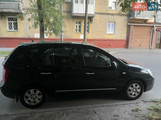 Черный Киа Каренс, объемом двигателя 2 л и пробегом 193 тыс. км за 6400 $, фото 4 на Automoto.ua