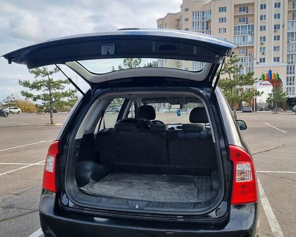 Черный Киа Каренс, объемом двигателя 2 л и пробегом 347 тыс. км за 5500 $, фото 4 на Automoto.ua