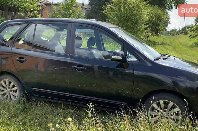 Чорний Кіа Каренс, об'ємом двигуна 2 л та пробігом 674 тис. км за 10000 $, фото 7 на Automoto.ua