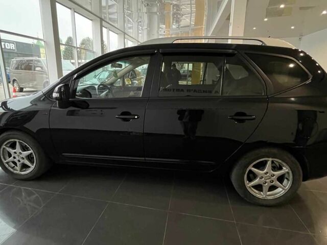 Черный Киа Каренс, объемом двигателя 1.6 л и пробегом 269 тыс. км за 7500 $, фото 3 на Automoto.ua