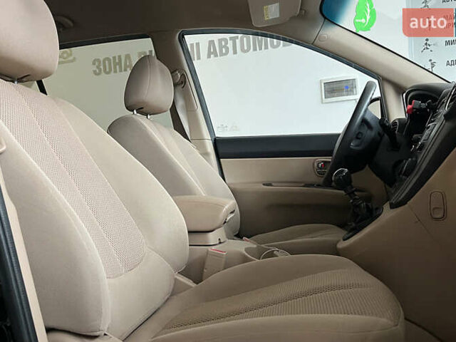 Чорний Кіа Каренс, об'ємом двигуна 1.58 л та пробігом 269 тис. км за 7500 $, фото 8 на Automoto.ua