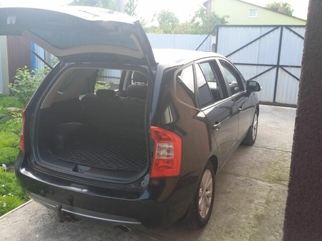 Черный Киа Каренс, объемом двигателя 2 л и пробегом 240 тыс. км за 6750 $, фото 4 на Automoto.ua