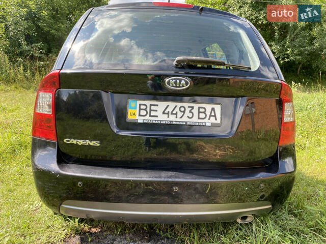 Чорний Кіа Каренс, об'ємом двигуна 2 л та пробігом 674 тис. км за 10000 $, фото 4 на Automoto.ua