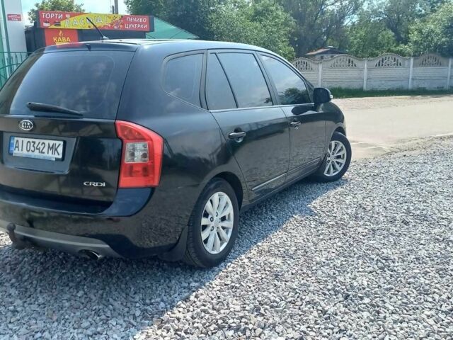 Черный Киа Каренс, объемом двигателя 2 л и пробегом 240 тыс. км за 6750 $, фото 1 на Automoto.ua