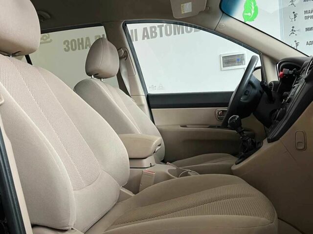 Черный Киа Каренс, объемом двигателя 1.6 л и пробегом 269 тыс. км за 7500 $, фото 8 на Automoto.ua