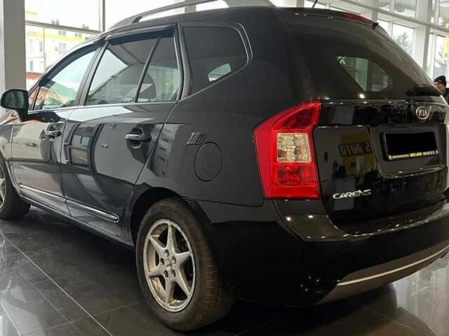 Черный Киа Каренс, объемом двигателя 1.6 л и пробегом 269 тыс. км за 7500 $, фото 4 на Automoto.ua