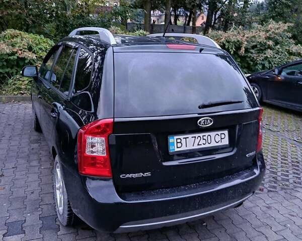 Черный Киа Каренс, объемом двигателя 1.58 л и пробегом 268 тыс. км за 6900 $, фото 3 на Automoto.ua