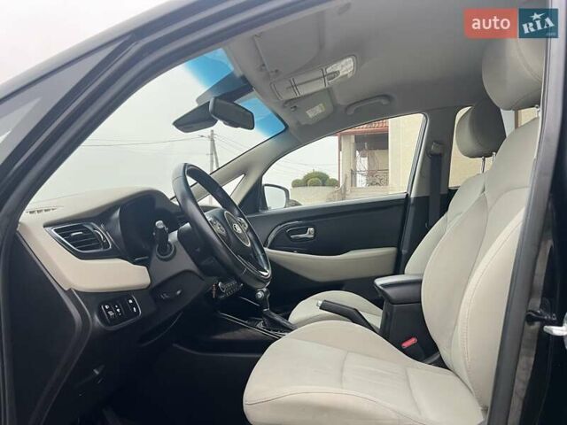 Черный Киа Каренс, объемом двигателя 1.69 л и пробегом 179 тыс. км за 10950 $, фото 65 на Automoto.ua