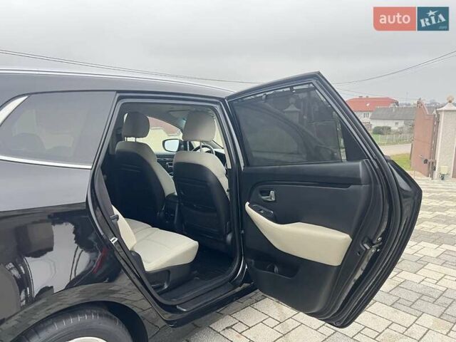 Черный Киа Каренс, объемом двигателя 1.69 л и пробегом 179 тыс. км за 10950 $, фото 98 на Automoto.ua