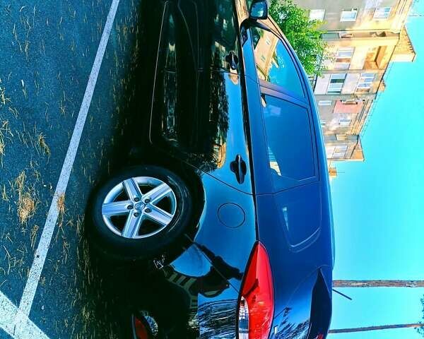 Чорний Кіа Каренс, об'ємом двигуна 1.7 л та пробігом 314 тис. км за 9500 $, фото 9 на Automoto.ua