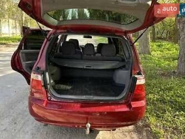 Красный Киа Каренс, объемом двигателя 2 л и пробегом 319 тыс. км за 4500 $, фото 1 на Automoto.ua