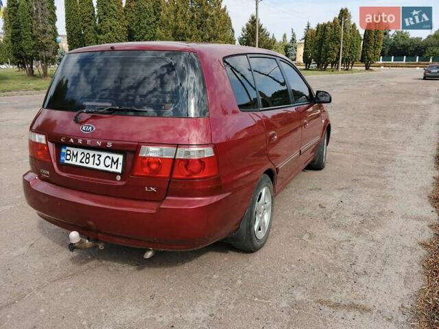 Красный Киа Каренс, объемом двигателя 2 л и пробегом 245 тыс. км за 4500 $, фото 8 на Automoto.ua
