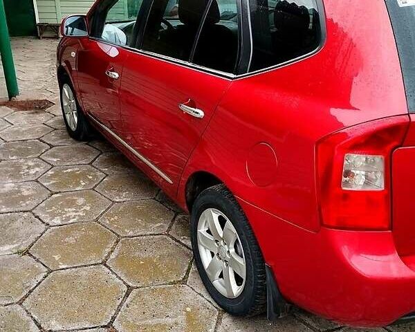 Червоний Кіа Каренс, об'ємом двигуна 2 л та пробігом 260 тис. км за 5800 $, фото 19 на Automoto.ua