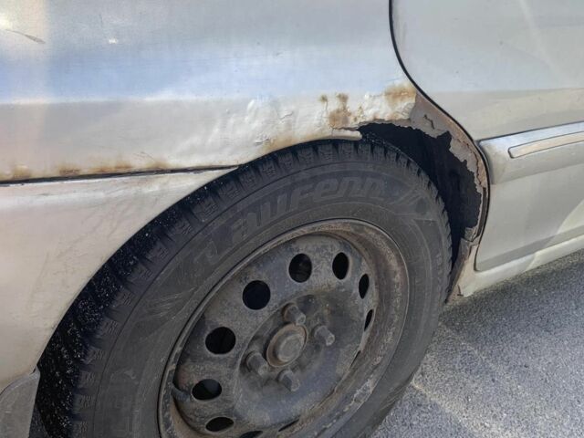 Серый Киа Каренс, объемом двигателя 2 л и пробегом 250 тыс. км за 834 $, фото 7 на Automoto.ua