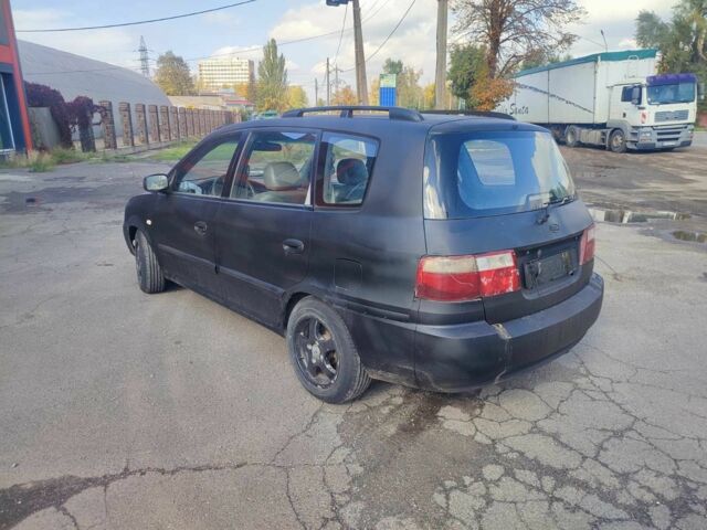 Серый Киа Каренс, объемом двигателя 2 л и пробегом 250 тыс. км за 1200 $, фото 3 на Automoto.ua