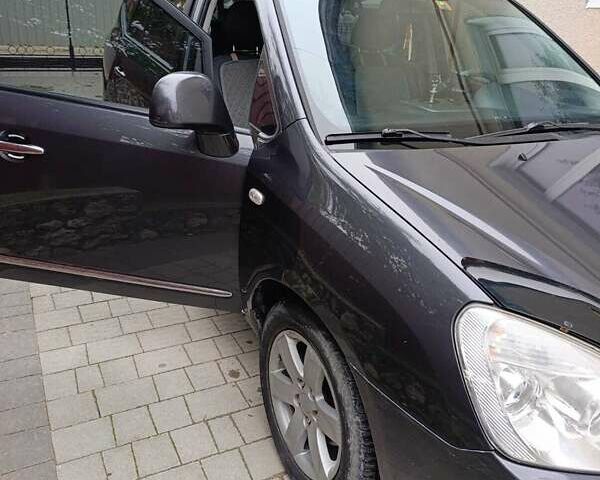 Сірий Кіа Каренс, об'ємом двигуна 2 л та пробігом 296 тис. км за 5600 $, фото 13 на Automoto.ua