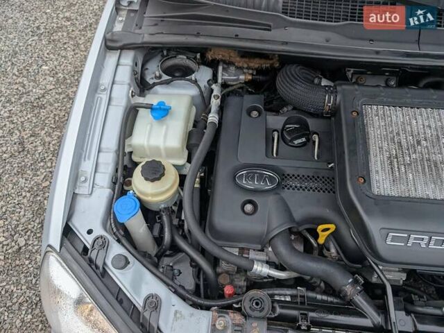 Серый Киа Каренс, объемом двигателя 2 л и пробегом 215 тыс. км за 5450 $, фото 41 на Automoto.ua
