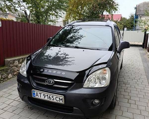 Сірий Кіа Каренс, об'ємом двигуна 2 л та пробігом 296 тис. км за 5600 $, фото 6 на Automoto.ua