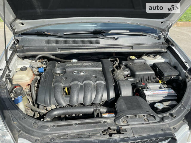 Сірий Кіа Каренс, об'ємом двигуна 2 л та пробігом 223 тис. км за 6999 $, фото 23 на Automoto.ua