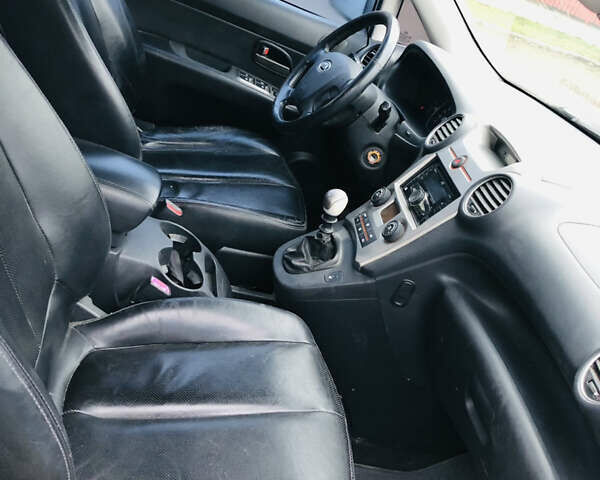 Серый Киа Каренс, объемом двигателя 1.99 л и пробегом 280 тыс. км за 4700 $, фото 7 на Automoto.ua