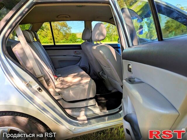Сірий Кіа Каренс, об'ємом двигуна 2 л та пробігом 227 тис. км за 5250 $, фото 7 на Automoto.ua