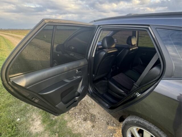 Серый Киа Каренс, объемом двигателя 2 л и пробегом 300 тыс. км за 6900 $, фото 4 на Automoto.ua