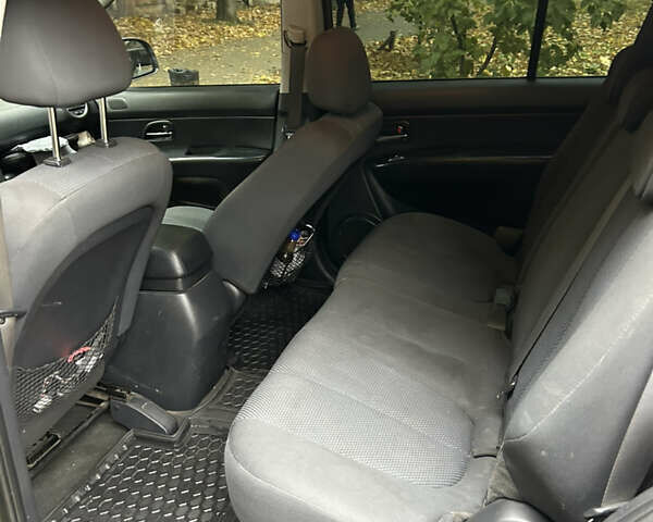 Серый Киа Каренс, объемом двигателя 1.58 л и пробегом 220 тыс. км за 8300 $, фото 14 на Automoto.ua