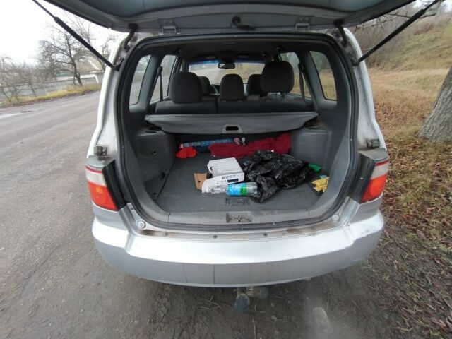 Серый Киа Каренс, объемом двигателя 2 л и пробегом 220 тыс. км за 1850 $, фото 6 на Automoto.ua