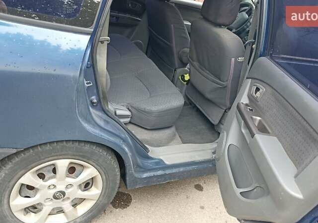 Синій Кіа Каренс, об'ємом двигуна 1.79 л та пробігом 313 тис. км за 2700 $, фото 5 на Automoto.ua