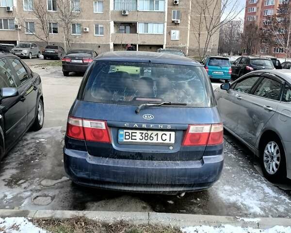 Синий Киа Каренс, объемом двигателя 2 л и пробегом 268 тыс. км за 4100 $, фото 3 на Automoto.ua