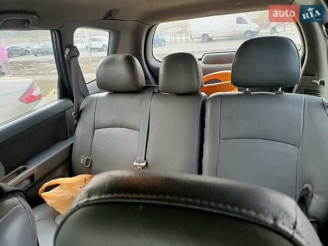 Синий Киа Каренс, объемом двигателя 2 л и пробегом 268 тыс. км за 4100 $, фото 1 на Automoto.ua