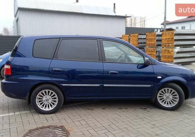 Синий Киа Каренс, объемом двигателя 2 л и пробегом 190 тыс. км за 4800 $, фото 1 на Automoto.ua