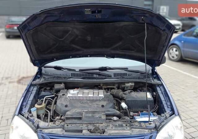 Синий Киа Каренс, объемом двигателя 2 л и пробегом 190 тыс. км за 4800 $, фото 11 на Automoto.ua