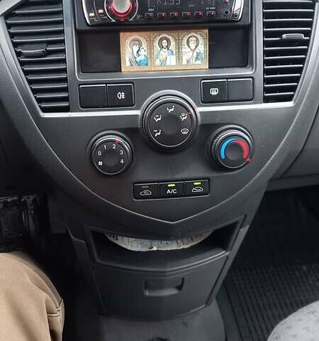 Синий Киа Каренс, объемом двигателя 2 л и пробегом 190 тыс. км за 4800 $, фото 34 на Automoto.ua