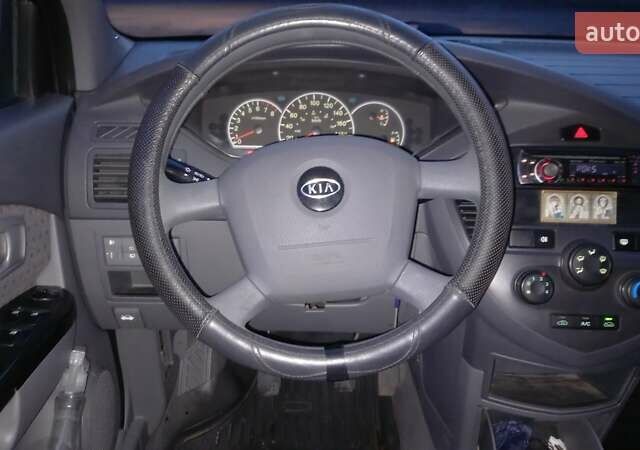 Синий Киа Каренс, объемом двигателя 2 л и пробегом 190 тыс. км за 4700 $, фото 19 на Automoto.ua