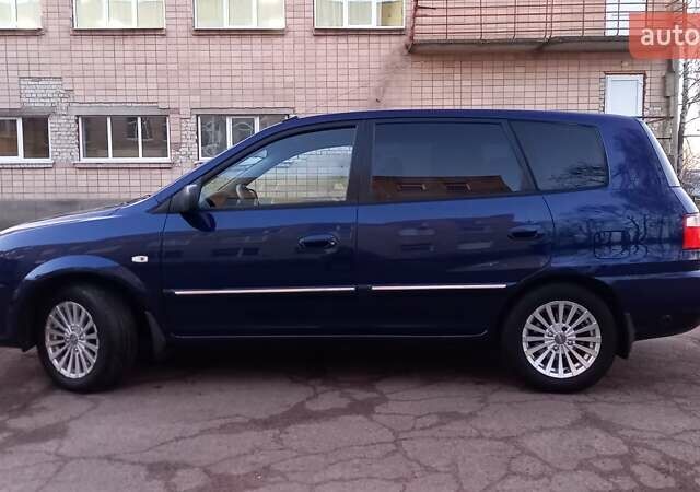 Синий Киа Каренс, объемом двигателя 2 л и пробегом 190 тыс. км за 4700 $, фото 6 на Automoto.ua