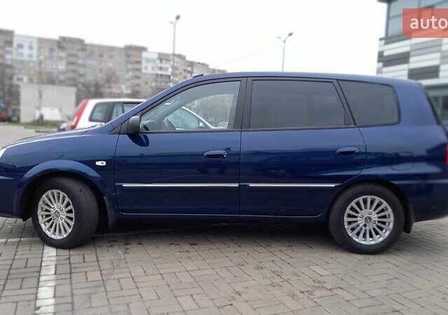 Синий Киа Каренс, объемом двигателя 2 л и пробегом 190 тыс. км за 4800 $, фото 7 на Automoto.ua