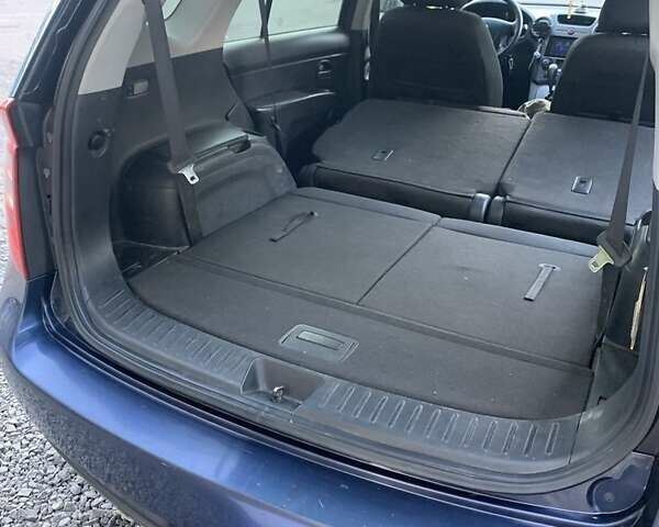 Синий Киа Каренс, объемом двигателя 2 л и пробегом 234 тыс. км за 6500 $, фото 3 на Automoto.ua