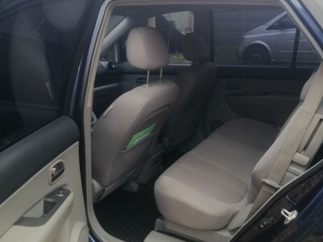 Синий Киа Каренс, объемом двигателя 2 л и пробегом 244 тыс. км за 6000 $, фото 6 на Automoto.ua