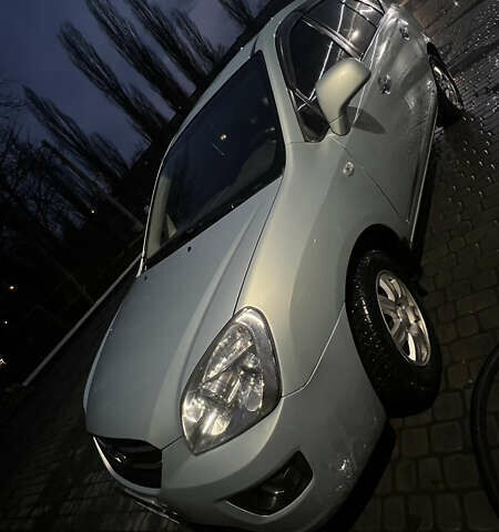 Синий Киа Каренс, объемом двигателя 2 л и пробегом 222 тыс. км за 5500 $, фото 1 на Automoto.ua