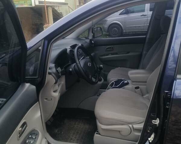 Синий Киа Каренс, объемом двигателя 2 л и пробегом 244 тыс. км за 6000 $, фото 1 на Automoto.ua