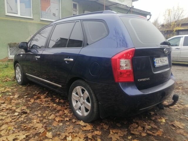 Синий Киа Каренс, объемом двигателя 2 л и пробегом 244 тыс. км за 6000 $, фото 3 на Automoto.ua