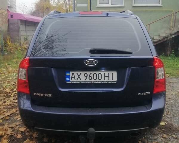 Синий Киа Каренс, объемом двигателя 2 л и пробегом 244 тыс. км за 6000 $, фото 3 на Automoto.ua