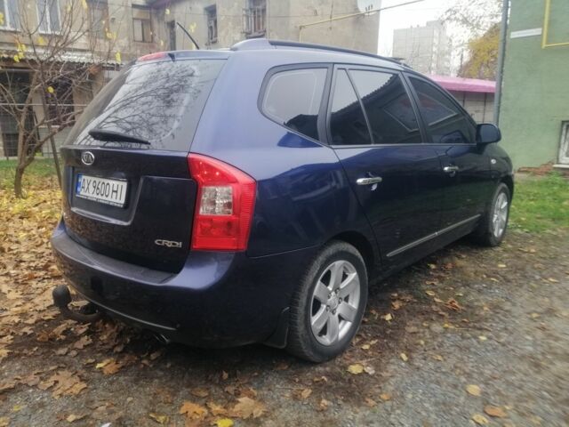 Синий Киа Каренс, объемом двигателя 2 л и пробегом 244 тыс. км за 6000 $, фото 4 на Automoto.ua