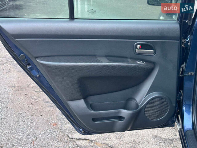 Синий Киа Каренс, объемом двигателя 2 л и пробегом 234 тыс. км за 6990 $, фото 14 на Automoto.ua